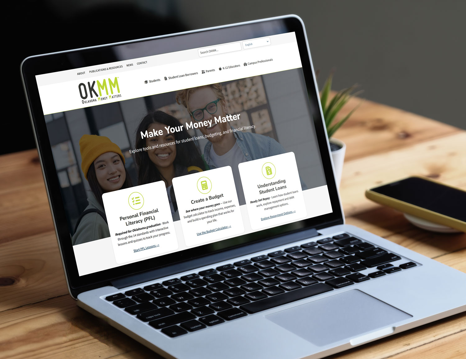 Laptop screen showing the Oklahoma Money Matters website